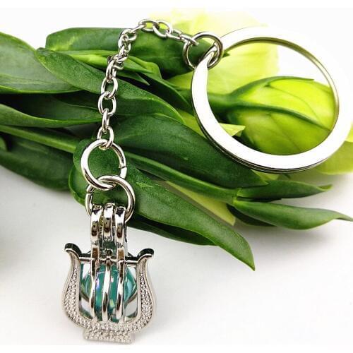 1PC Delicate Oil Lamps,dog,horse,Angel Cartoon Aromatherapy Key Chains Perfume Essential Oil Diffuser Cage Locket Key buckle