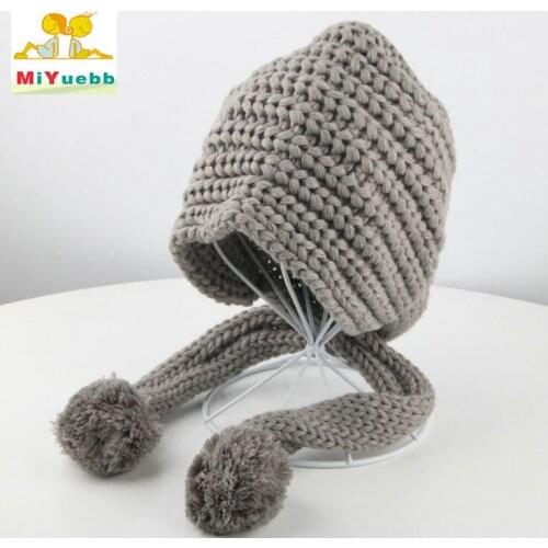 New child Winter girls 2-7 years old wool Solid color cap Handmade hat outdoor warm Fashion ball ear protection MZ14