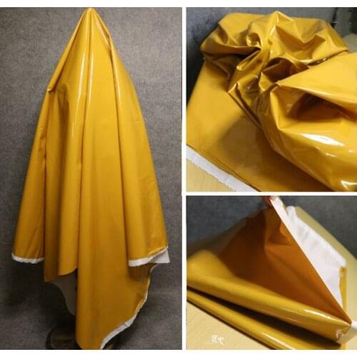 Egg yolk reflective mirror crystal satin is wide and silky designer fabric