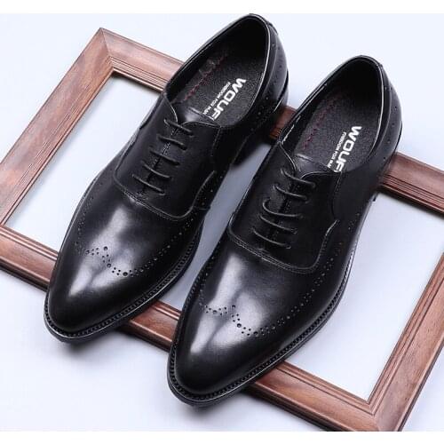British leather shoes man, carved lace, formal wedding wear, fashion dress, cowhide. The block