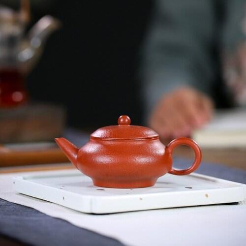 Yixing purple clay teapot master handmade pear peel vermilion clay horizontal teapot 150cc household kungfu tea set