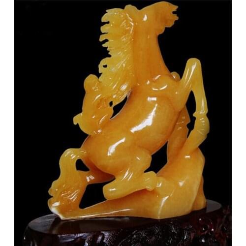 A pair of beige and jade ornaments