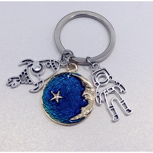Astronautics extraterrestrial space satellite rocket spaceship five planets planet astronaut keychain