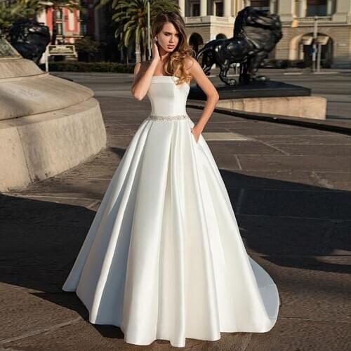 Delicate Satin Stapless Neckline A-line Bridal Dress Open Back Beading Sash Wedding Dress with Pocket