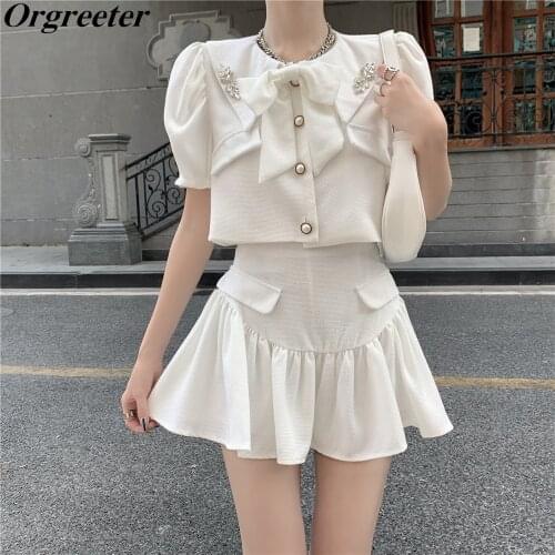 Fashion Sweet Bowknot White Two piece set Women 2021 Summer New Diamond Lapel Crop Tops and High waist Pleated Skirts Suits