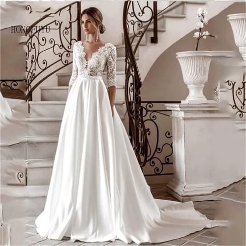 Elegant Lace Wedding Dresses 2021 Sexy V-neck illusion Long Sleeve Boho Beach Bridal Gown Sweep Train Marriage robe de mariée