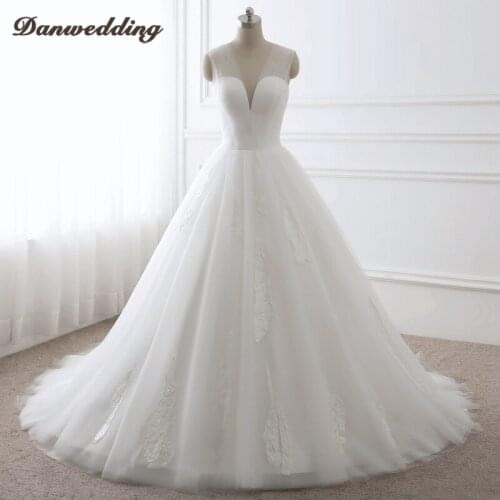 Gorgeous Ball Gown Wedding Dress Sexy Deep V-Neck Lace Applique Bridal Dress Chapel Train Sleeveless Real Photo Weddiing Gowns