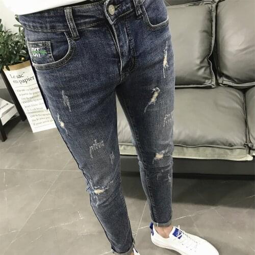 Wholesale 2021 Fashion washed blue personality Ripped hole scratches denim trousers mens summer new slim feet pencil jeans