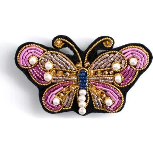 Manual butterfly badge