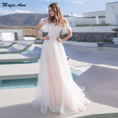 Magic Awn Charming Lace Tulle Wedding Dresses Light Pink Cap Sleeves Appliques Illusion Princess Modest Bride Dress A-Line 2021