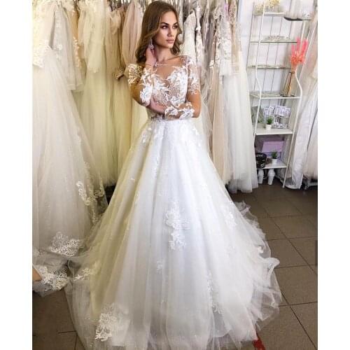 Ivory Long Sleeve Beach Wedding Dress 2021 Sexy Illusion Backless Bohemian Boho Princess Lace Appliques Beads Bridal Gowns Scoop