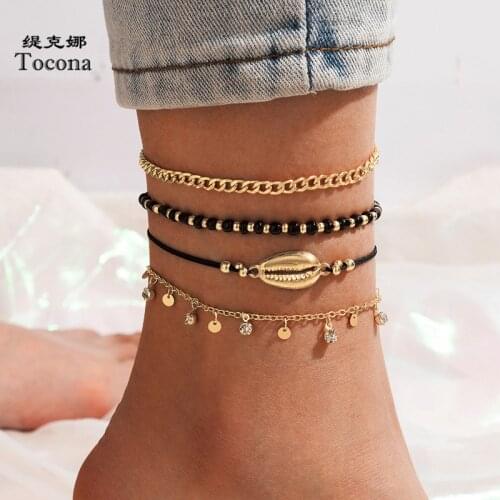 Tocona 4pcs/sets Boho Black Bead Shell Foot Chain for Women Gold Color Alloy Metal Tassel Anklets Summer Jewelry Gift 17495