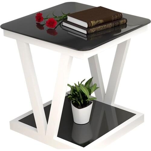 Side a few simple glass mini small tea table small square corner a few sofas next to the small table bedroom bedside table