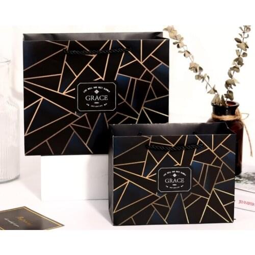 China Suppliers Customized Business Shopping Kraft Paper Packaging Bag,Kraft paper bag for clothing --XP2237