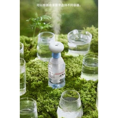Small desktop portable mineral water bottle household silent spray fog volume car air simple donut humidifier J03