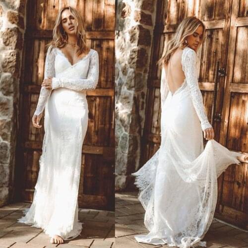 2020 African Mermaid Wedding Dresses Plus Size V Neck Long Sleeve Lace Bridal Gowns Appliqued Backless Floor Length Wedding