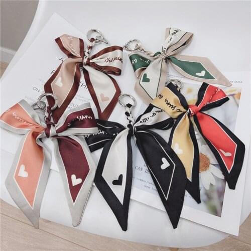 2021 High Quality Fashion Scarves Key holder Ribbon Bowknot Exquisite Ribbon Silk Fabric Keychains Women Bag Charm Pendant