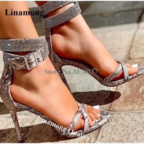 Linamong New Shining Rhinestone Ankle Strap Stiletto Heel Gladiator Sandals Snake Leather Crystal High Heel Sandals Dress Heels