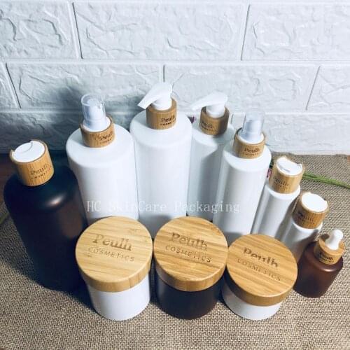 Wholesale Custom Logo Cosmetic Jar With Bamboo Lid Women Professional Beauty Makeup Tools Plastic Lotion Shampoo Perfume Bottles