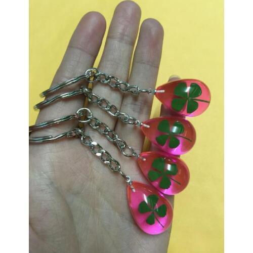 FREE SHIPPING wholesale 24 PCS green real four leaf clover jewelry pink back drop keychain