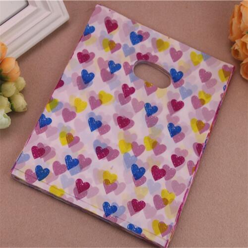 2016 New Design Wholesale 100pcs/lot 20*25cm Colorful Small Heart Present Packaging Bags Plastic Shopping Bags With Handle