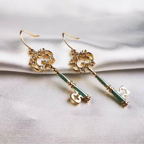 High sense earrings female French light luxury retro long skinny key national wind earrings suitable for autumn and winter all-m