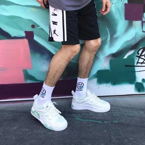 Tide brand little devil smiley face ins trend tube socks couple street sports men and women cotton socks