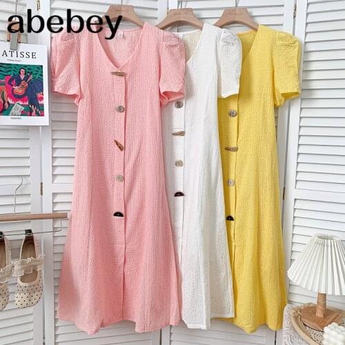 Temperament V-neck puff sleeve Dress single breasted button decoration solid mid-length A-line Dress 2021 New Summer