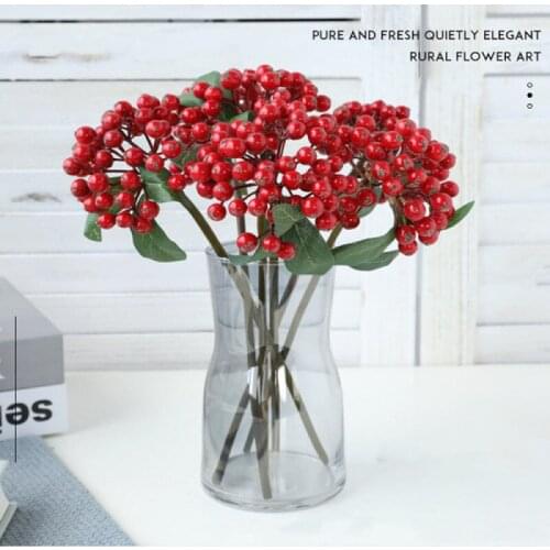 Imitation of berry berry bunche branches, ferro fruit, caramel, decorated floral arrangement with Christmas berry accessories