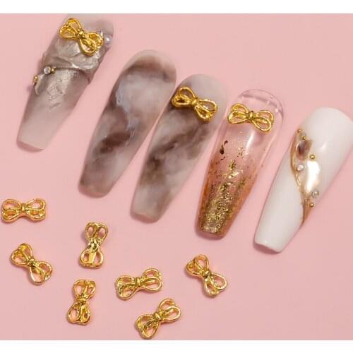 Nail art 1 pack 10pcs alloy mini Butterfly cravat gold hollow silver DIY nail art creative decoration accessories Best-selling