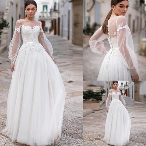 Beach Wedding Dresses 2020 Lace Appliques Puff Long Sleeves Bridal Wedding Gowns Buttons Backless Floor Length Vestido De Noiva