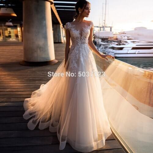 2021 A Line Beach Wedding Dresses Lace Appliques Cap Sleeves Wedding Bridal Gown Floor Length Vestido De Noiva Plus Size
