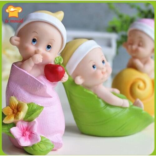 Hand holding apple doll silicone mold holiday wedding candle soap mould flower cloth bag baby
