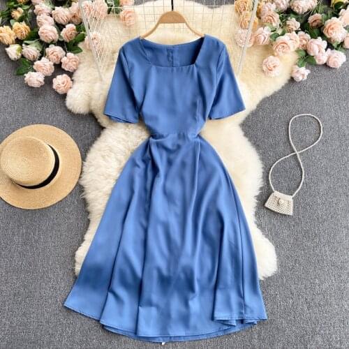 Design contrast color strap waist dress 2021 new scheming hollow out waist slimming mid-length holiday skirt women