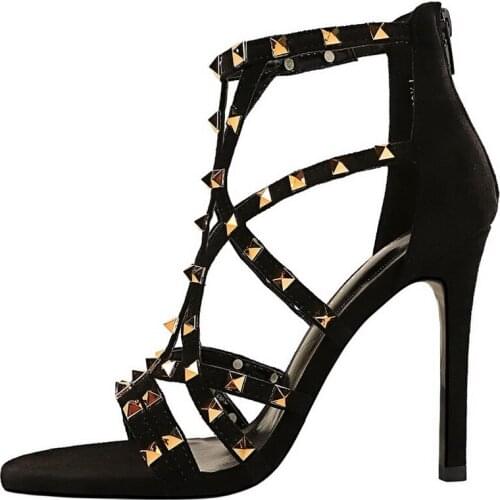 European and American fashion sexy nightclub thin heel super high heel suede metal rivet hollow sandals Roman shoes