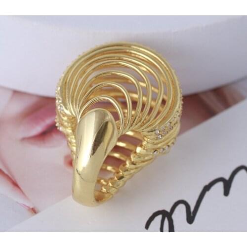 Exaggerated ring with interlaced lines and diamonds