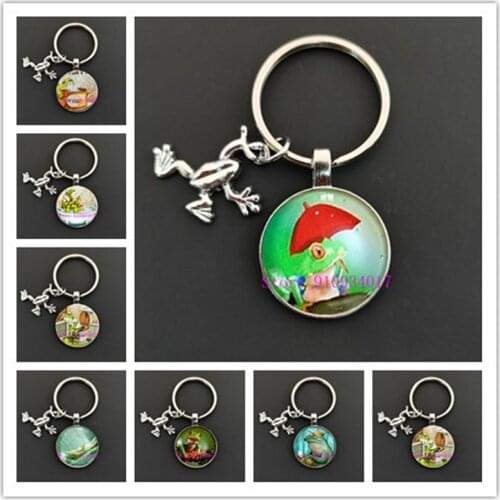 Funny frog toilet paper round glass keychain on the toilet keychain, cute anime frog decoration keychain for boys and girls