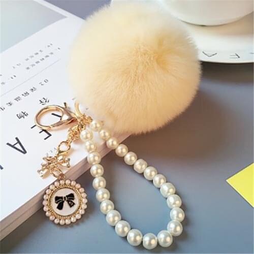 2021 Fashion Pearl Chain Crystal Bottle Bow Pompom Keychain Car Women handBag Key Chain Ring Fluffy Puff Ball Keychains Jewelry