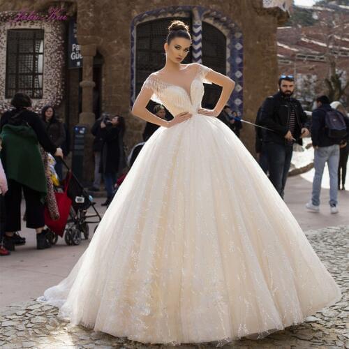 Julia Kui Luxury Shiny Bling Tulle Illusion O-Neck Ball Gown Wedding Dresses With Beading Pearls Tassel Backless Bride Gowns