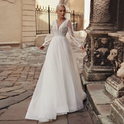 Bohemian Boho Lace Wedding Dresses 2021 New Long Puffy Sleeves Beach Tulle Bridal Gowns V-Neck Open Back Elegant Bride Gowns