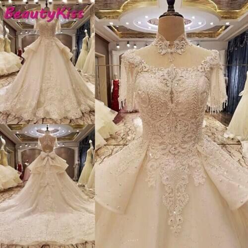Luxury Arabic Wedding Dresses 2020 Crystals Lace High Neck Wedding Gowns Beading Appliques Royal Train Bridal Gowns With Bow
