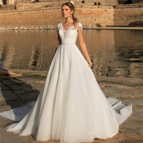 Luxury Ball Gown Wedding Gowns 2021 Cap Sleeve V Neck Bridal Dresses Beading Applique Long Train Bride Dress Vestido De Noiva