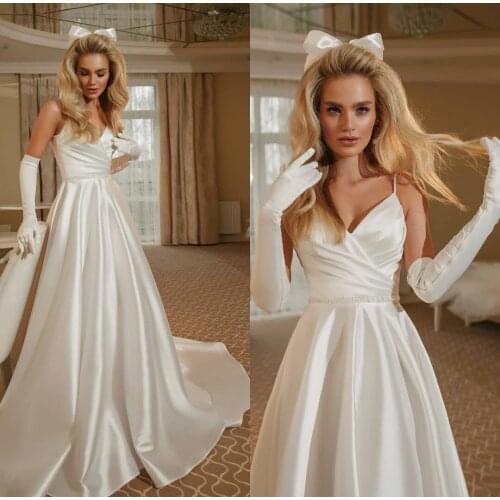 Elegant Long Satin V-Neck Spaghetti Wedding Dresses with Pockets Criss Cross Back A-Line Robes De Mariée Bridal Gown For Women