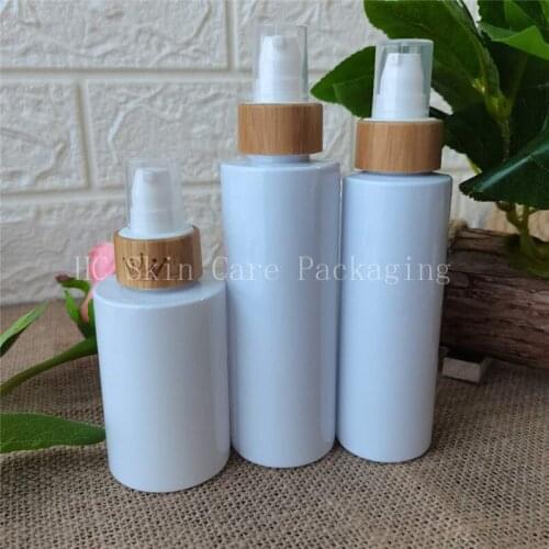 100pcs/lot white/amber/frosted plastic bottles with bamboo wood lid plastic toner water spray cap bottle empty cosmetic set