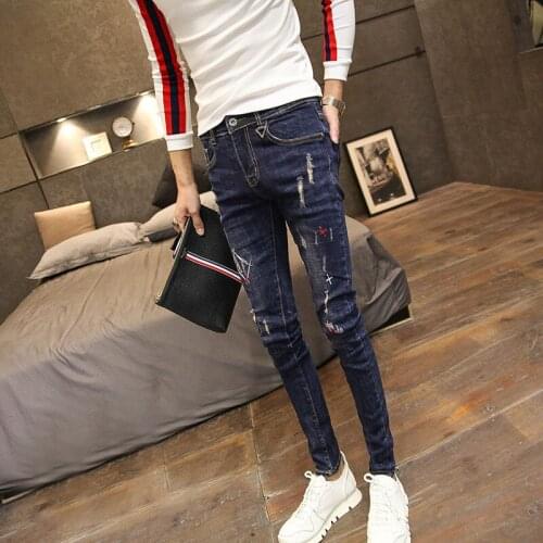 Simple fashion cowboy personality stitched decorative jeans mens spring and autumn slim Korean stretch teenager pencil pants