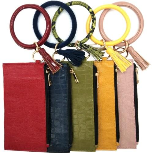 Crocodile pattern PU solid color wallet + PU bracelet tassel key chain European and American leather wrist handbag
