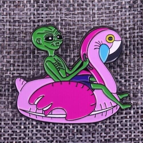Alien riding a bird badge brooch