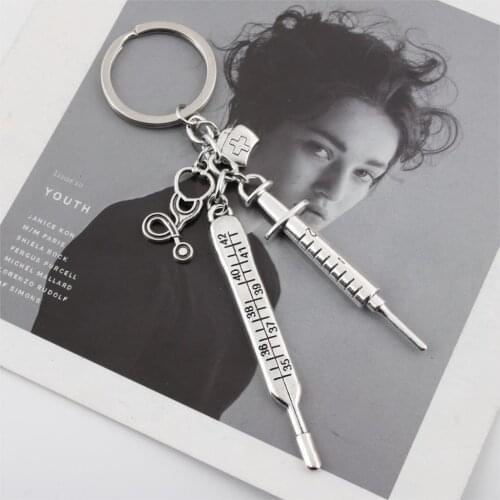 Medical doctors and nurses clinical thermometers syringe needles stethoscope nurse cap hospital keychain