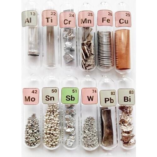 A glass seal of a set of 12 element samples collected from the Periodic Table Bi Ni Al Pb Cr Sn Ti Mn Fe Cu Mo W