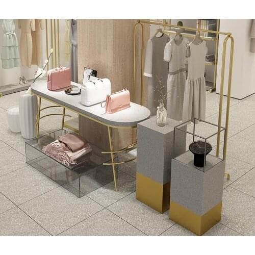 Mijin clothing store high and low water table. Shoe and bag window display stand